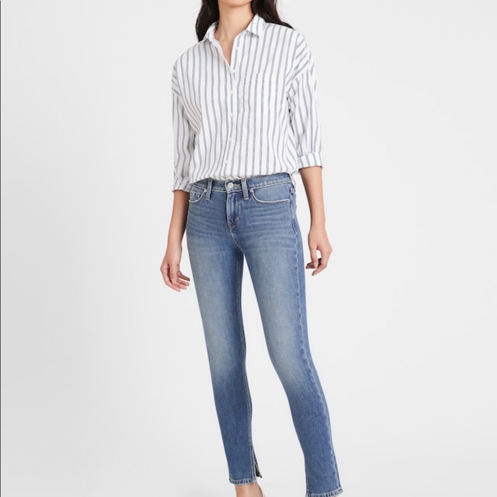 Banana Republic mid rise skinny jean with split hem.
